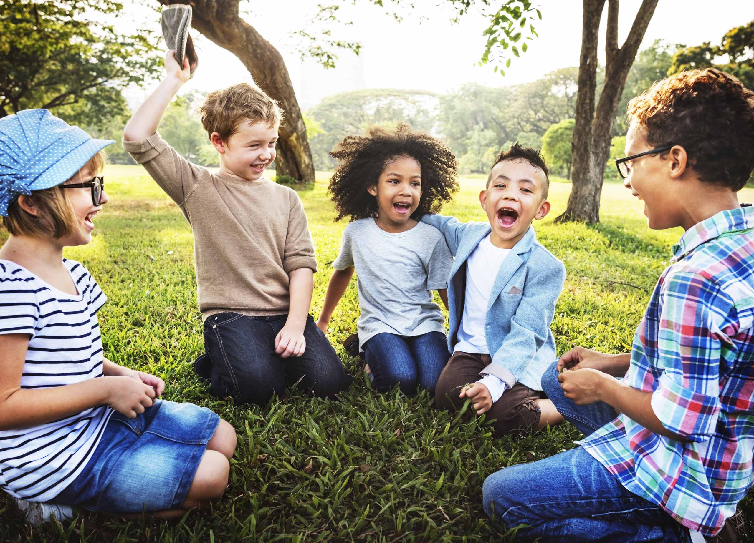 Foster Children Playing In Park